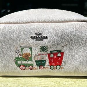 Coach White Leather Cosmetic Pouch with Red and Green Holiday Train Motif